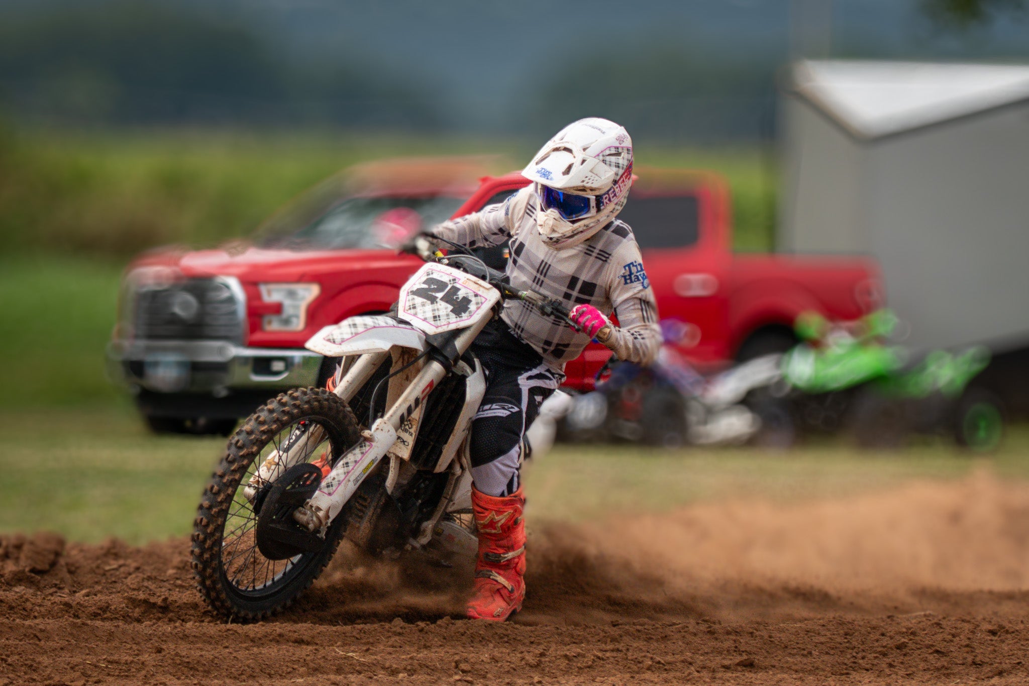 Thomas Soule from Soule Racing riding a dirt bike on a track at ascot park on labor day 2025 with a red truck in the background